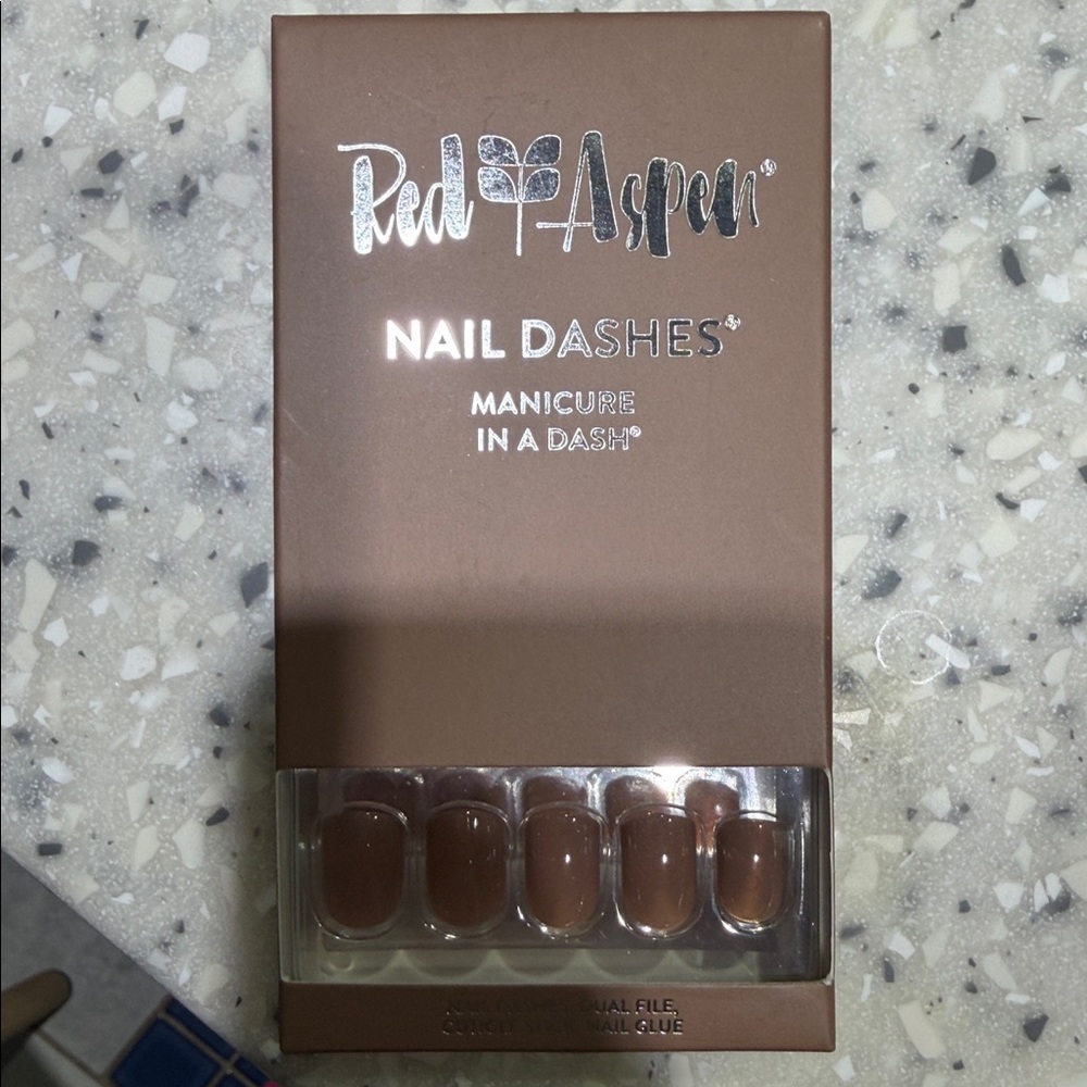Red Aspen latte glue on Nails